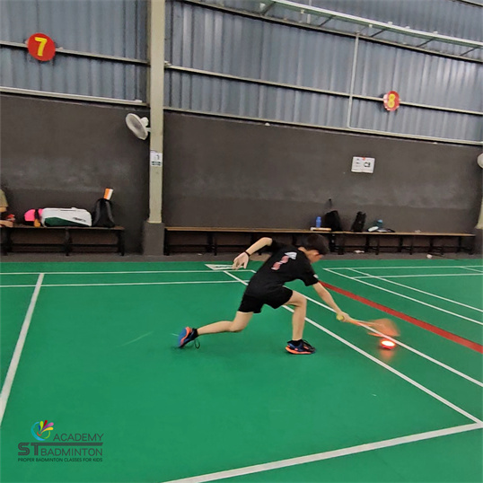 Children learning proper badminton skills in Wangsa Maju by ST Badminton Academy