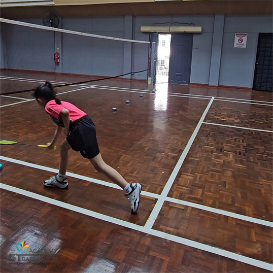 Certified badminton coach training kids in Wangsa Maju community centre