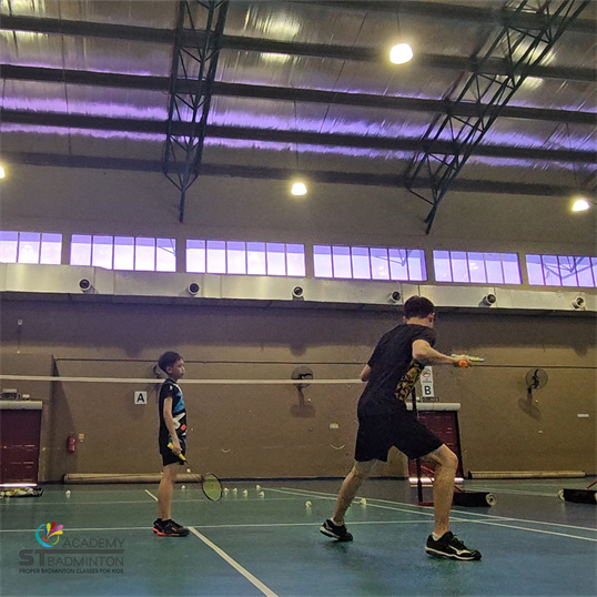 ST Badminton Academy coaching students at Taman Melati Multipurpose Hall