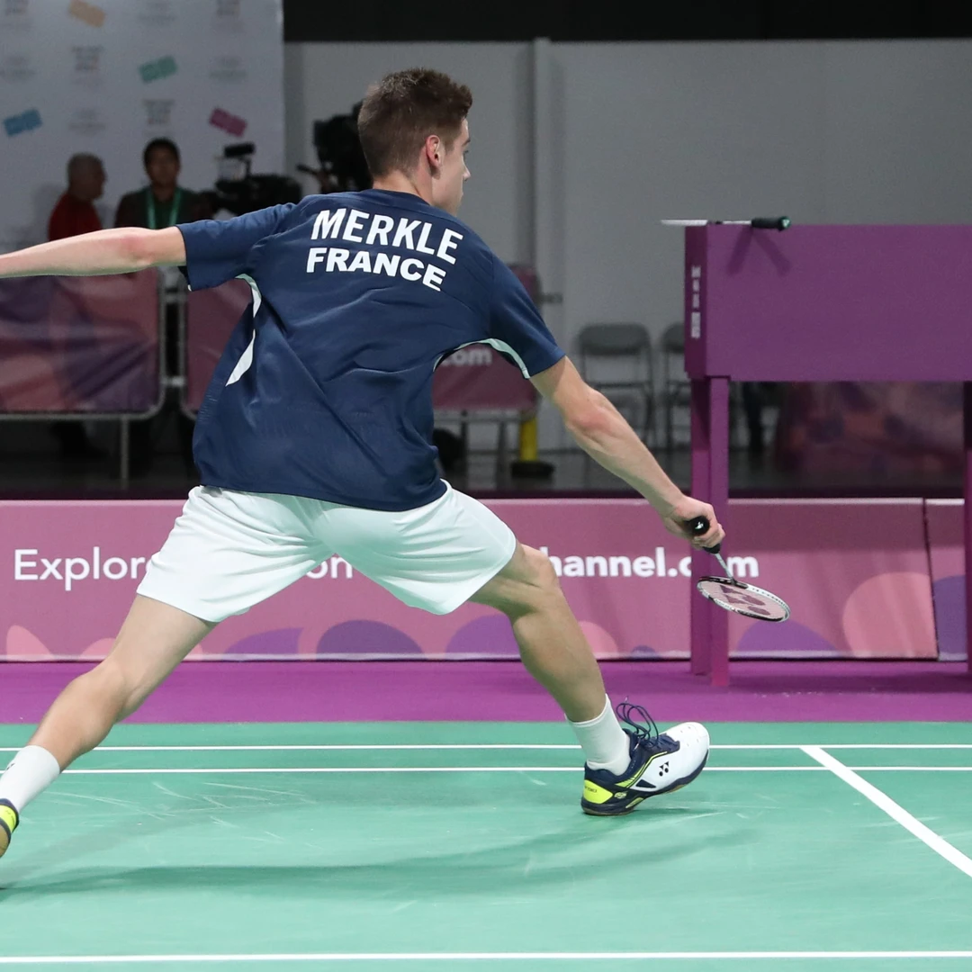 Arnaud Merkle backhand side defence Arnaud Merkle stretching wide on the backhand side, seen from behind, at the 2018 Youth Olympic Games