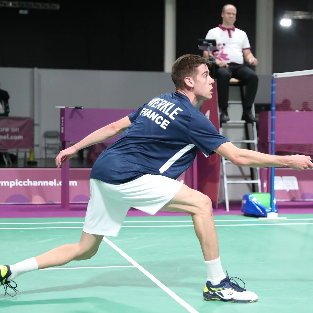 Arnaud Merkle net play Arnaud Merkle playing a net shot at the net post at the 2018 Youth Olympic Games