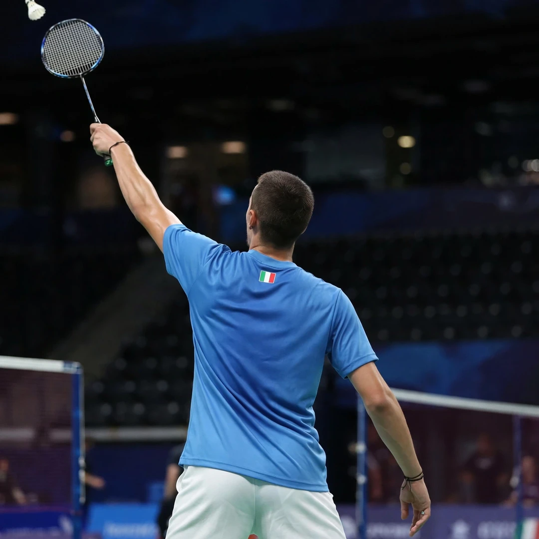 Giovanni Toti reaching into the deep backhand corner, seen from behind (AI-generated) Giovanni Toti reaching into the deep backhand corner, seen from behind (AI-generated)