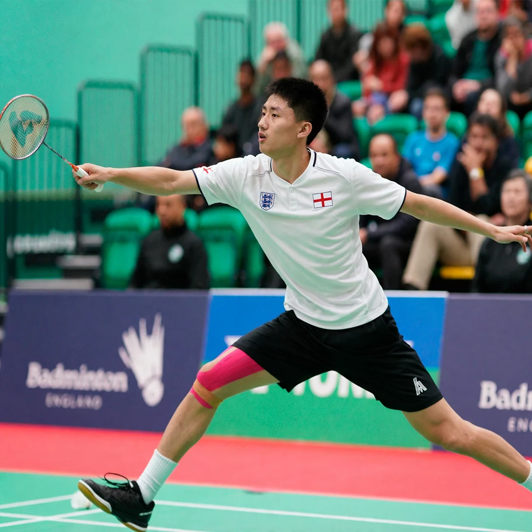 Harry Huang Harry Huang stretched out wide reaching for a backhand (AI-generated)