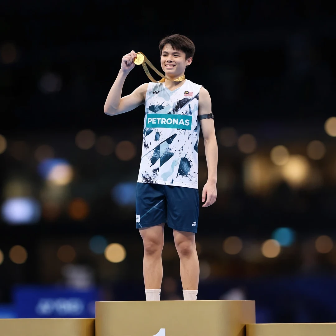 Justin Hoh junior champion AI-generated Justin Hoh holding up his gold medal on the podium as a junior champion in 2019 (AI-generated)