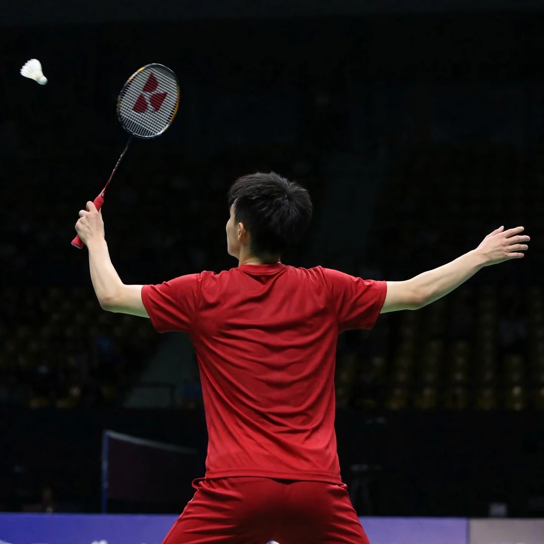 Wang Zheng Xing playing a backhand clear from the rear corner (AI-generated)