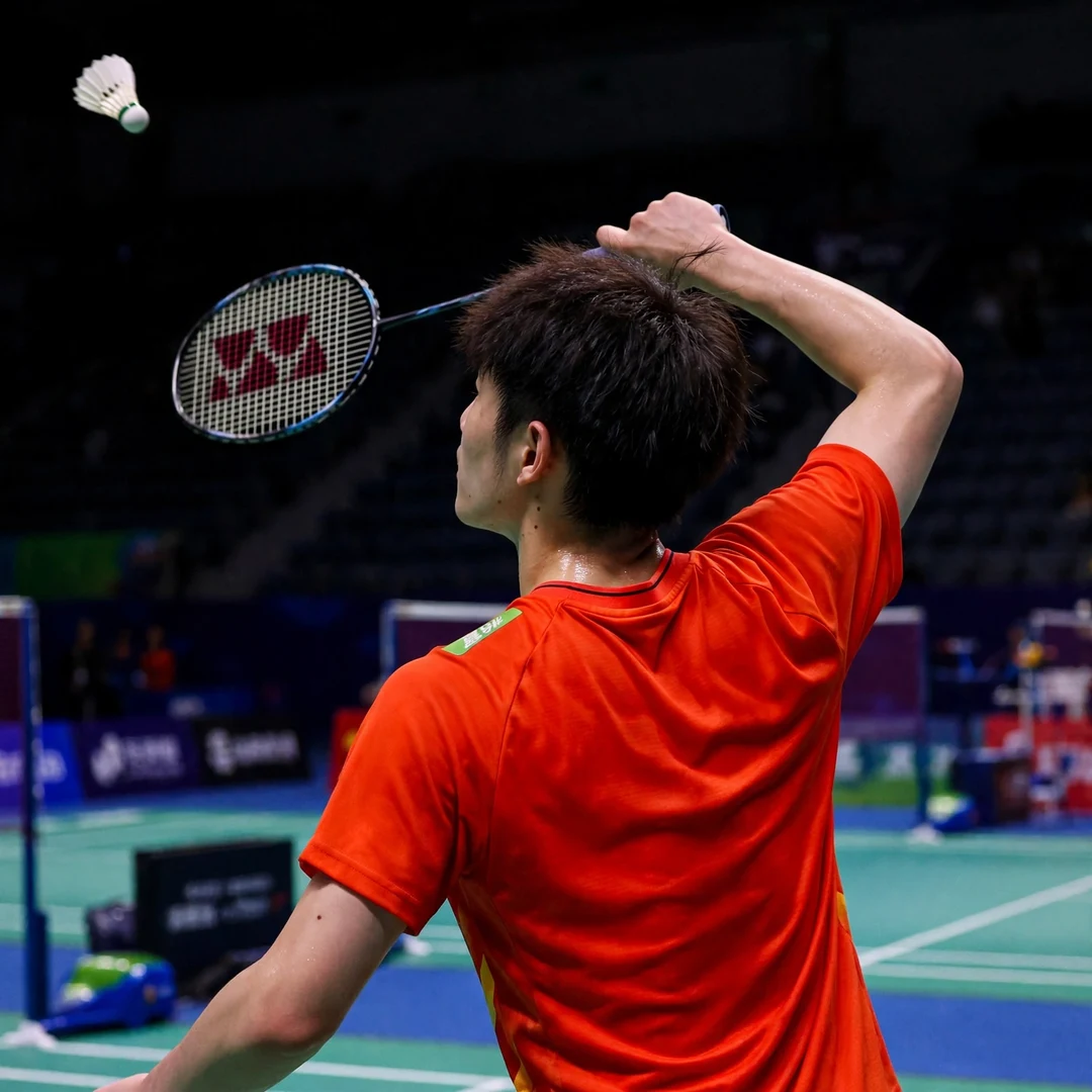 Zhu Xuan Chen backhand clear Zhu Xuan Chen playing an overhead backhand clear from the deep backhand corner (AI-generated)